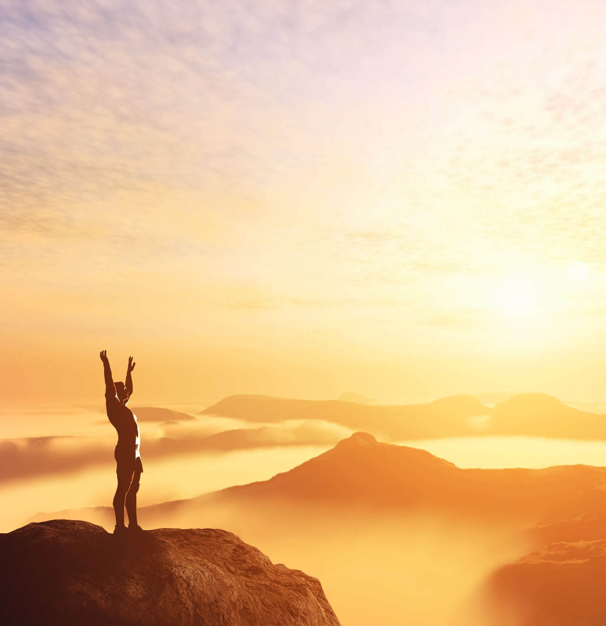 Moving Minds Hypnotherapy - a person spreading her arm so happy to feel the breeze at the top of the mountain